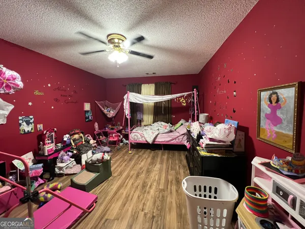 a bedroom with furniture and a window