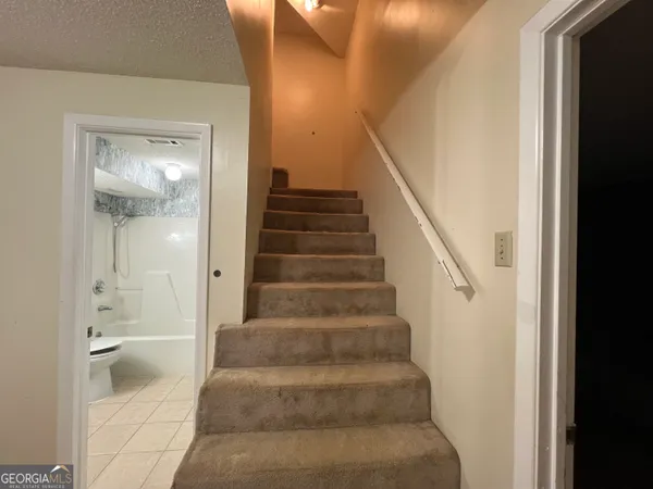 a view of room with cabinets