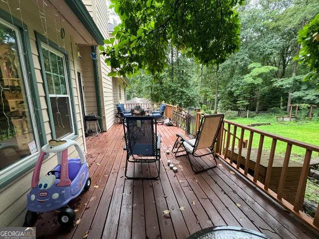 a view of a backyard with swimming pool