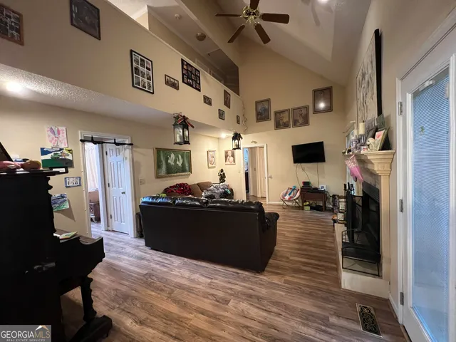 a living room with furniture and a fireplace