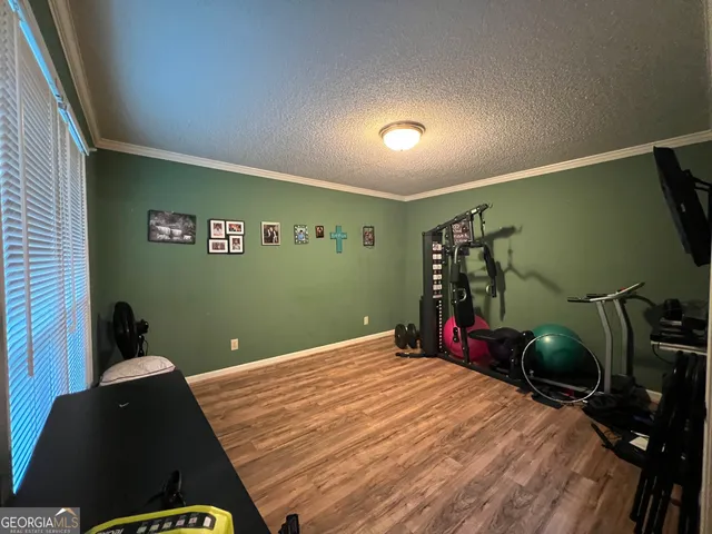 a view of a livingroom with furniture and a window