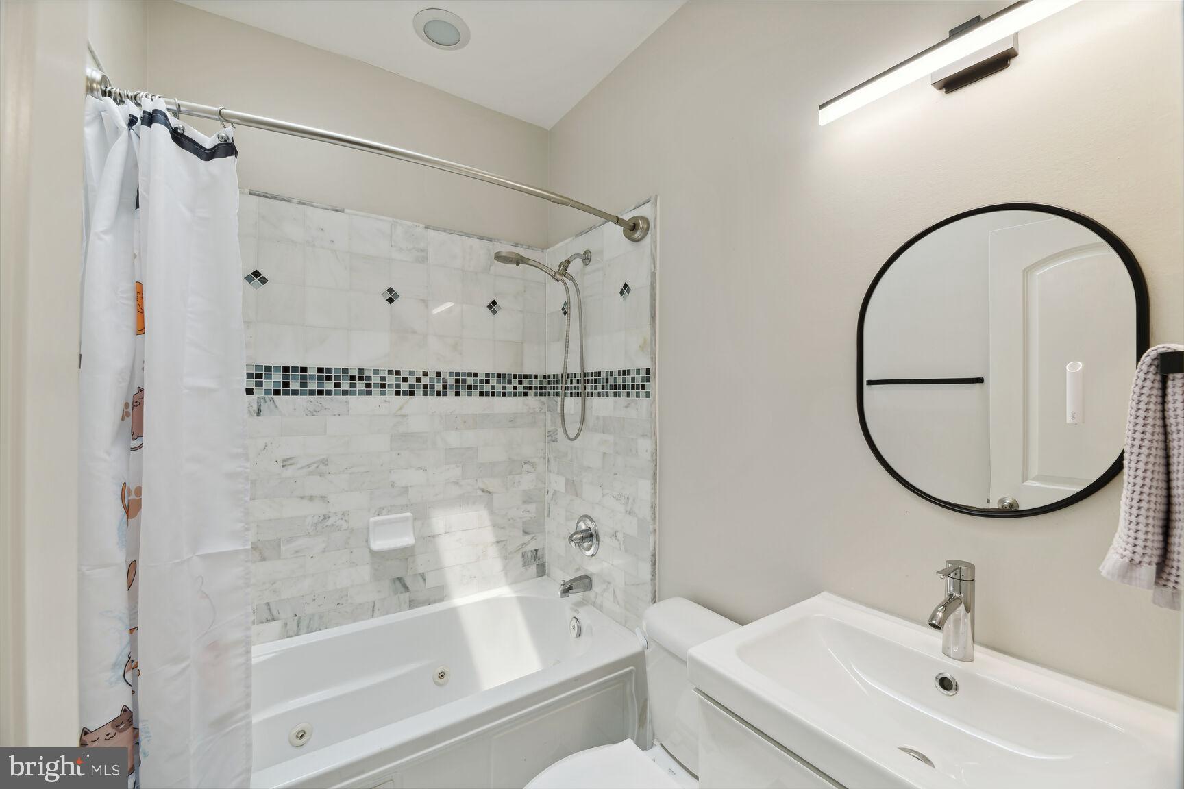708 E Street Northeast Washington, DC 20002 - Photo 19 of 28 Skylight and Jetted Tub in Bathroom Number Two