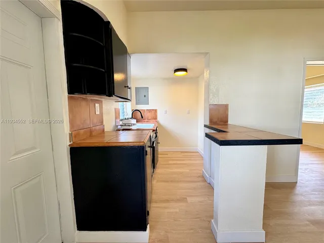 a view of living room with furniture and flat screen tv
