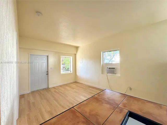 a view of an empty room and window