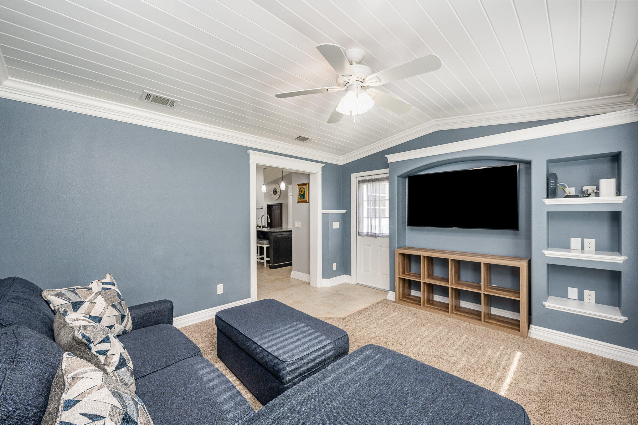 1140 Commerce Road Southeast Palm Bay, FL 32909 - Photo 12 of 24 a living room with furniture and a flat screen tv