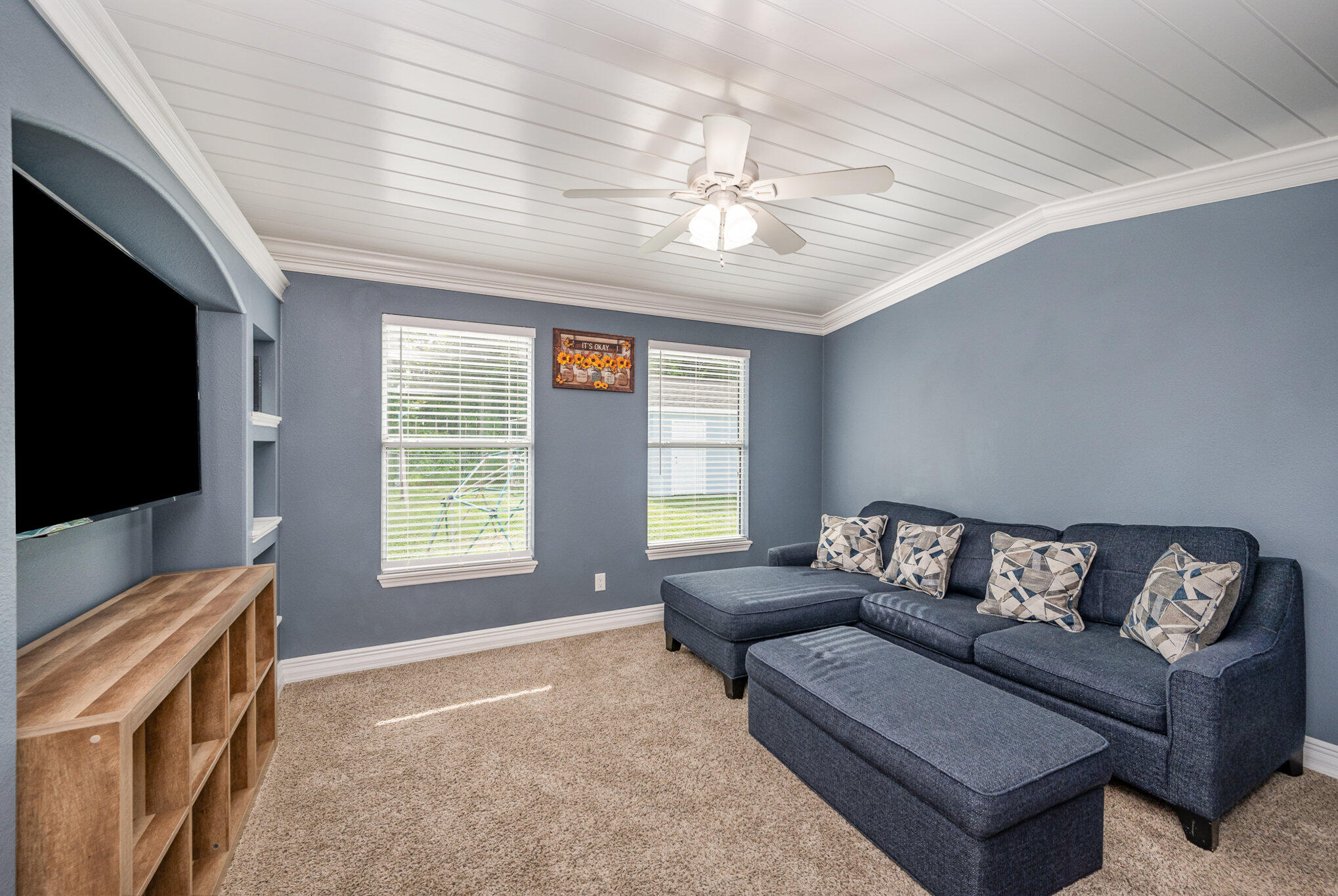 1140 Commerce Road Southeast Palm Bay, FL 32909 - Photo 13 of 24 a living room with furniture and a flat screen tv