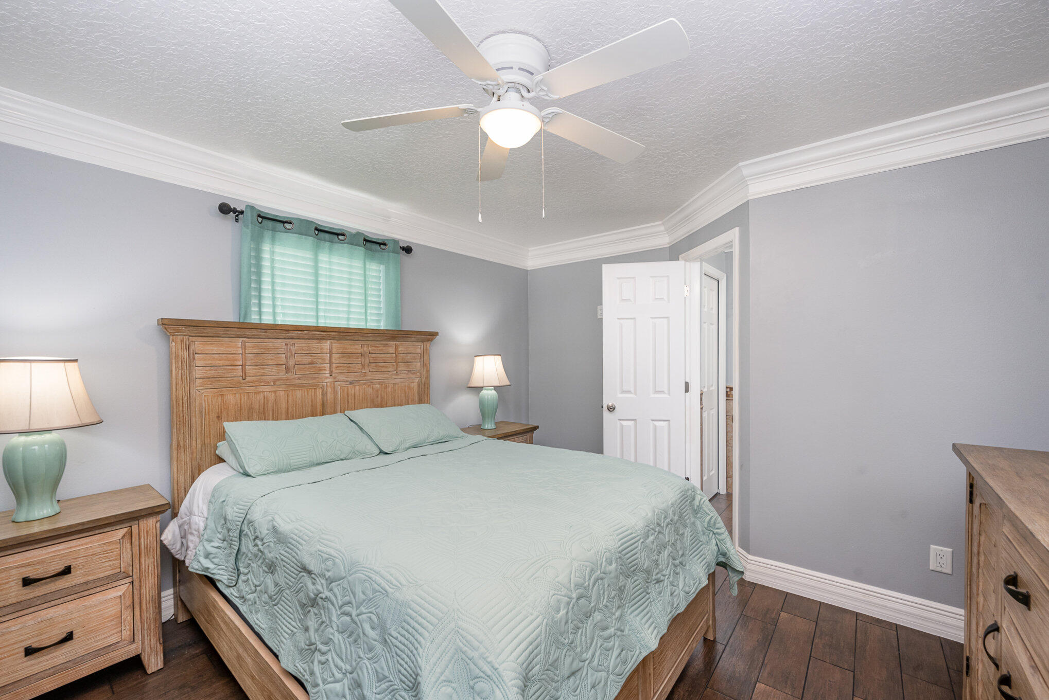 1140 Commerce Road Southeast Palm Bay, FL 32909 - Photo 14 of 24 a bedroom with a bed and a potted plant