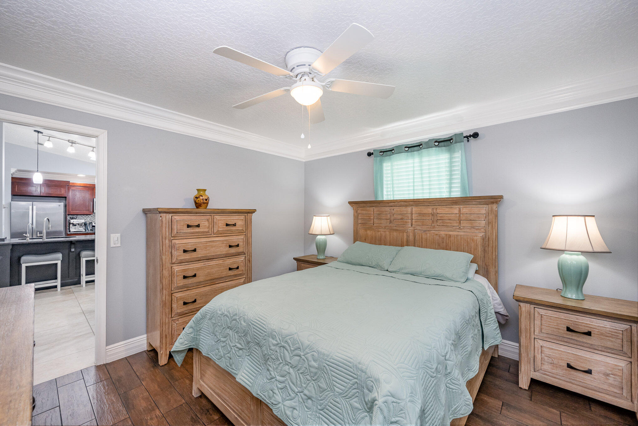 1140 Commerce Road Southeast Palm Bay, FL 32909 - Photo 15 of 24 a bedroom with a bed and a chandelier