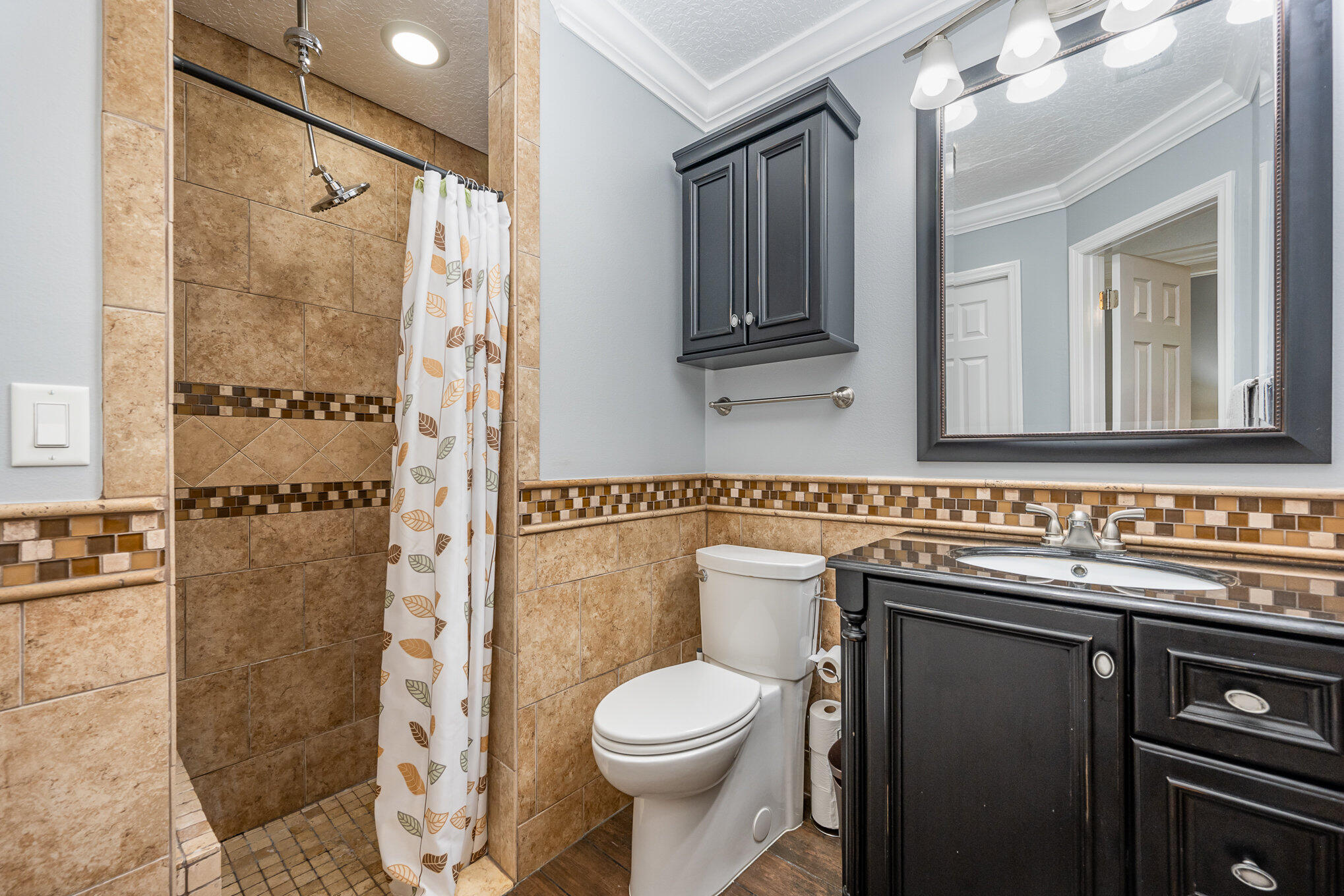 1140 Commerce Road Southeast Palm Bay, FL 32909 - Photo 16 of 24 a bathroom with a sink toilet and shower