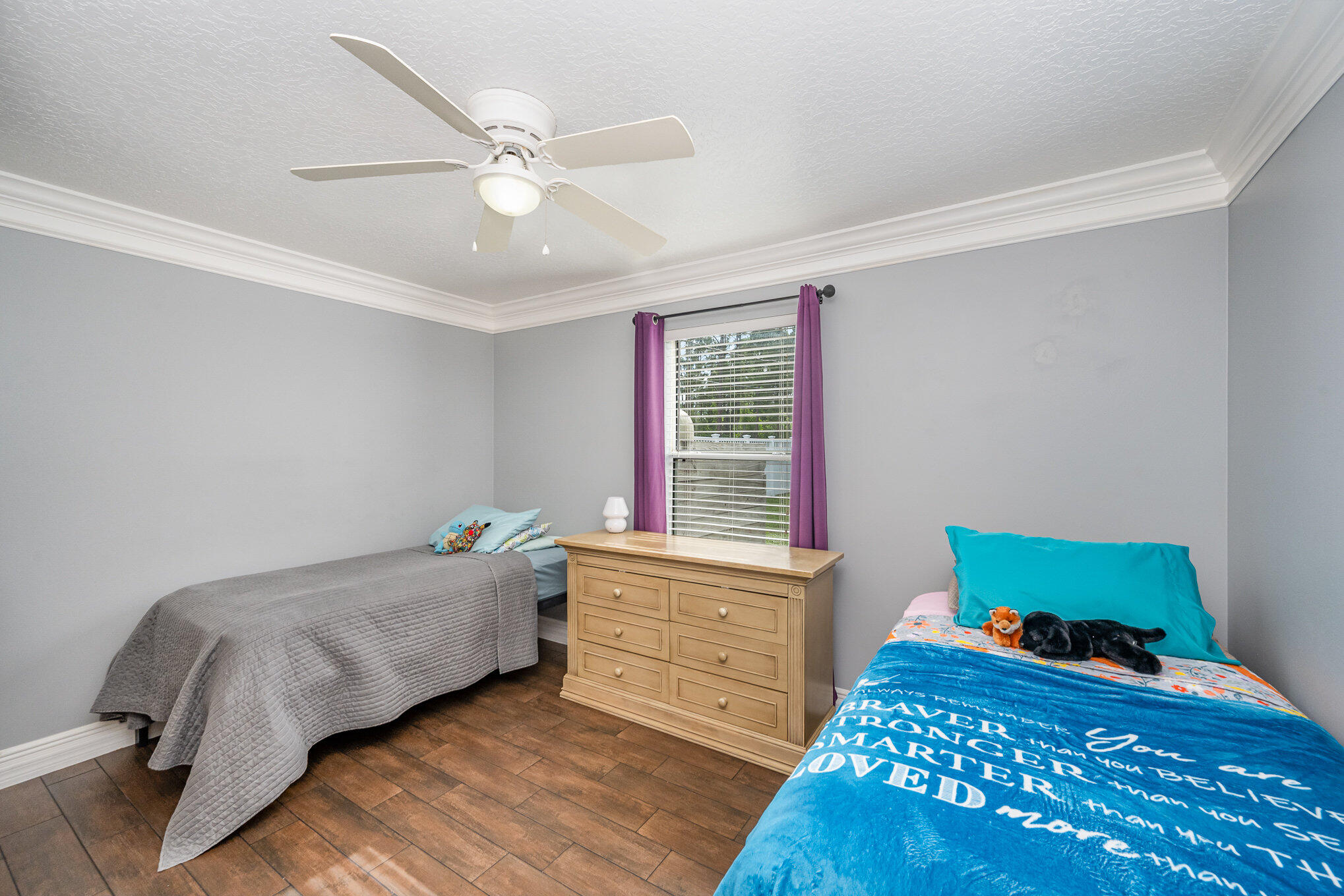 1140 Commerce Road Southeast Palm Bay, FL 32909 - Photo 17 of 24 a bedroom with a bed and a window