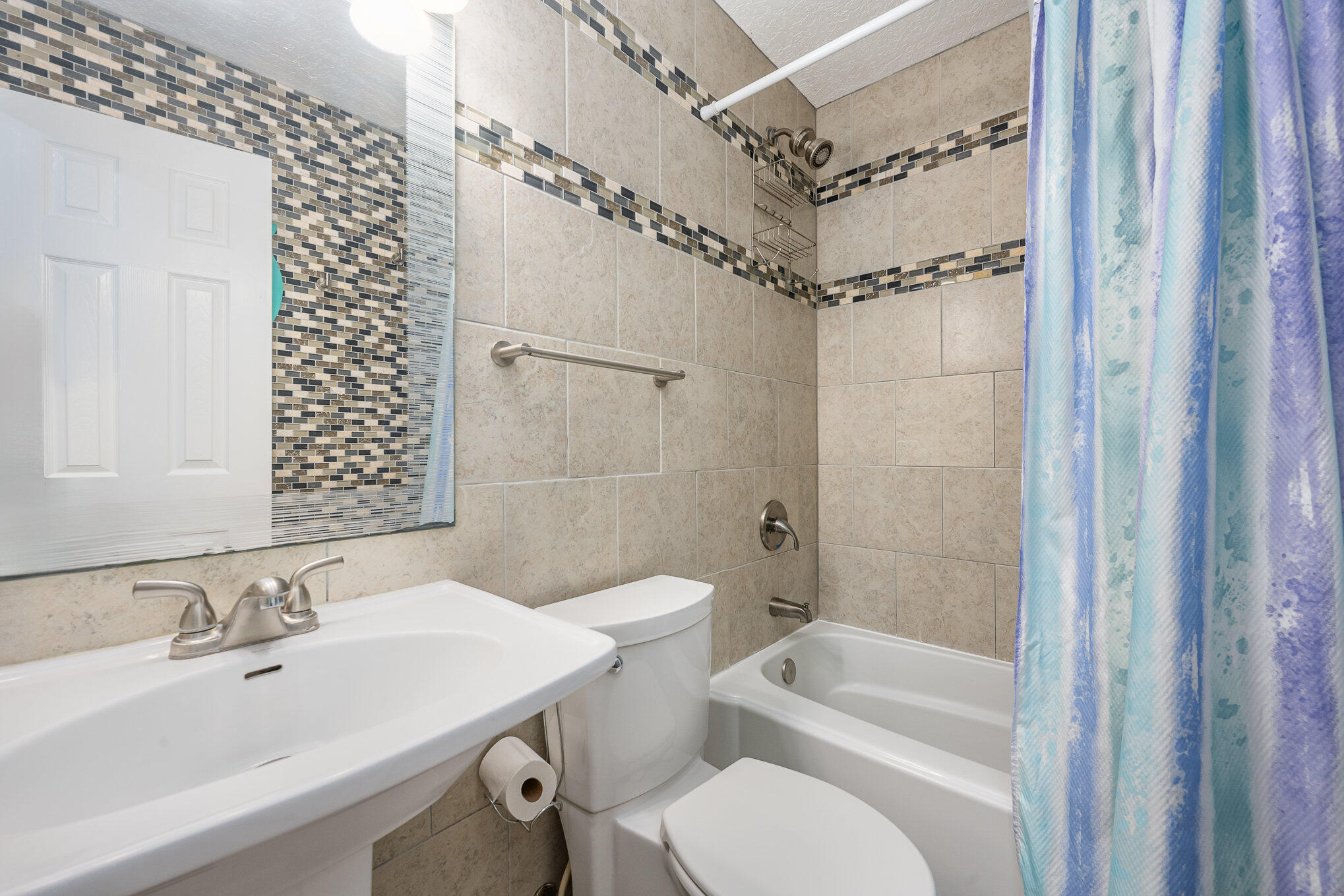 1140 Commerce Road Southeast Palm Bay, FL 32909 - Photo 19 of 24 a bathroom with a sink toilet tub and shower