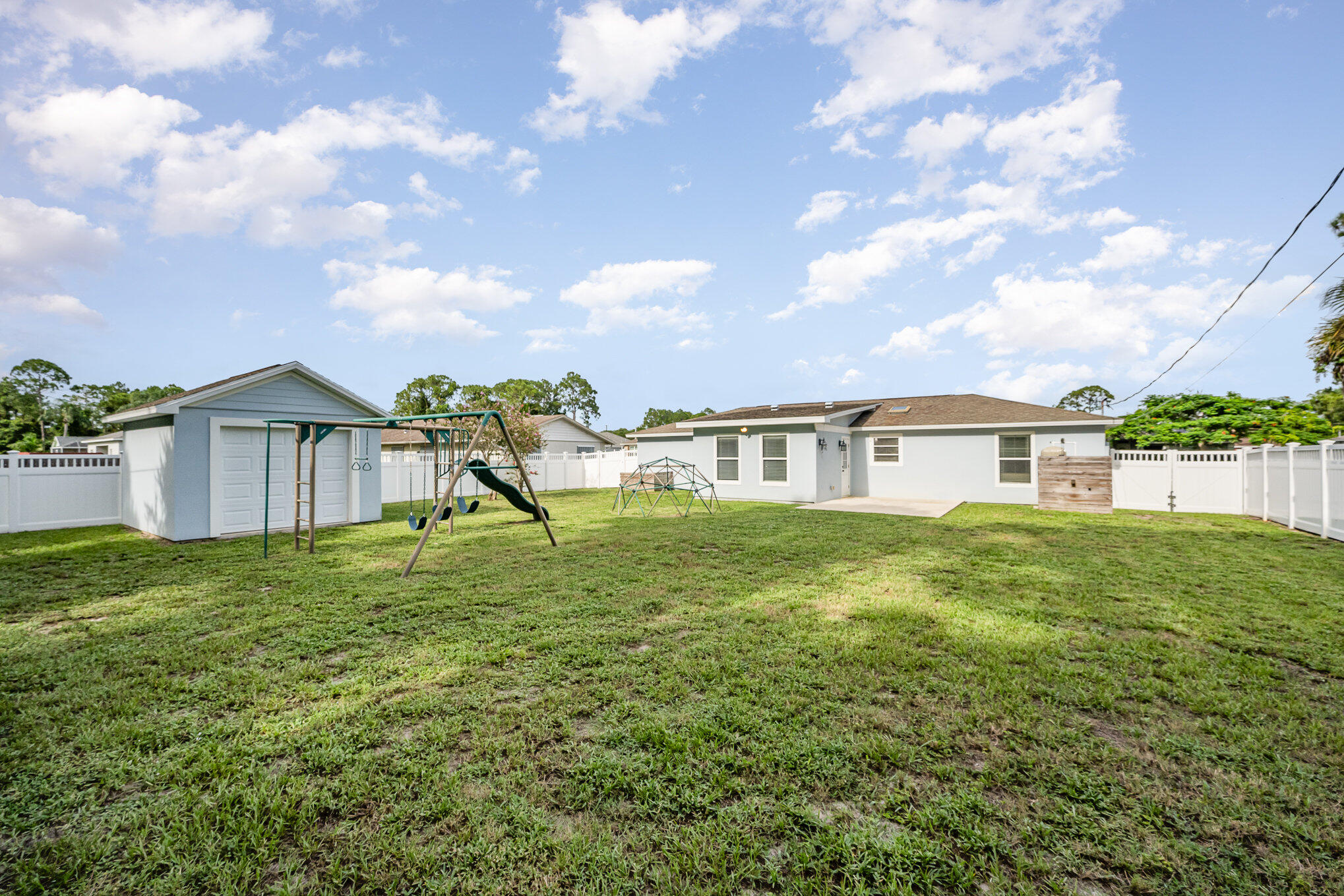 1140 Commerce Road Southeast Palm Bay, FL 32909 - Photo 22 of 24 a view of a house with a yard and sitting area