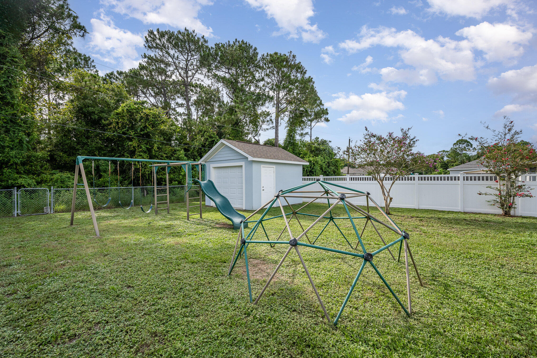 1140 Commerce Road Southeast Palm Bay, FL 32909 - Photo 24 of 24 a backyard of a house with table and chairs