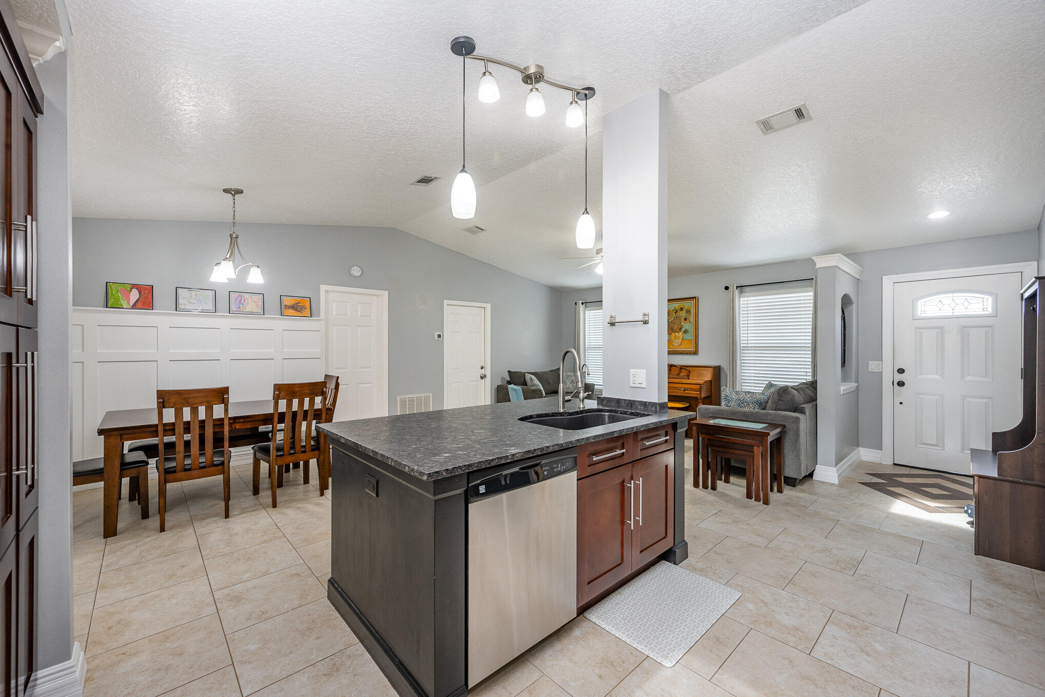 1140 Commerce Road Southeast Palm Bay, FL 32909 - Photo 4 of 24 a kitchen with a table and chairs in it