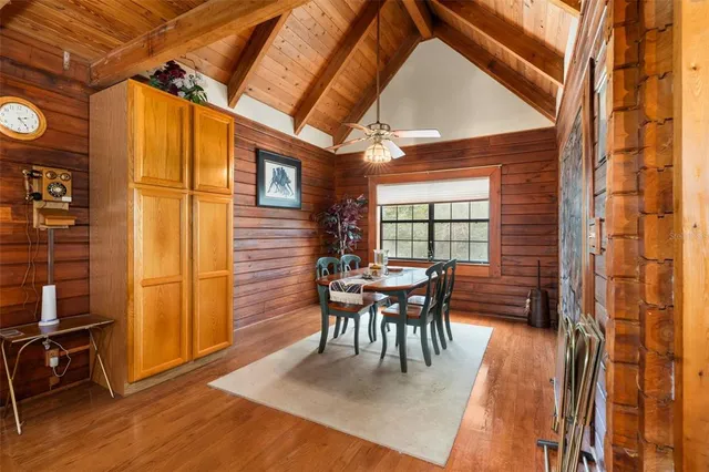 a kitchen with refrigerator and cabinets