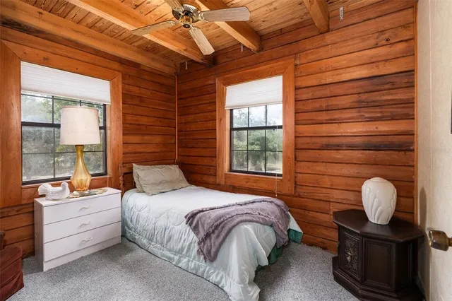 a bedroom with furniture and a window