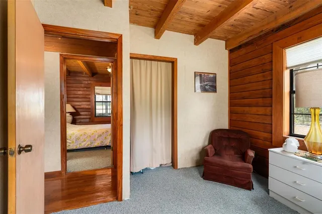 a bathroom with a granite countertop sink toilet and mirror