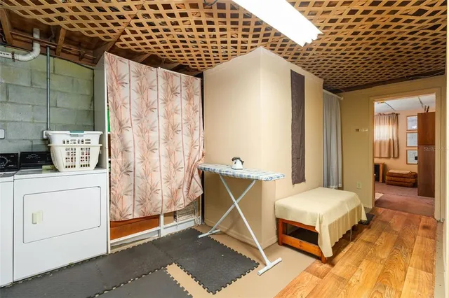 a bedroom with a bed and a mirror