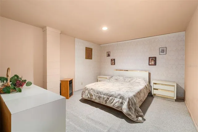 a bedroom with furniture and a window