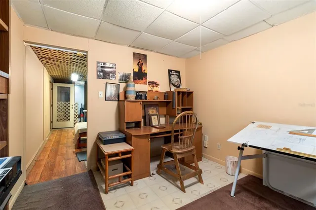a view of a porch with furniture and floor to ceiling window