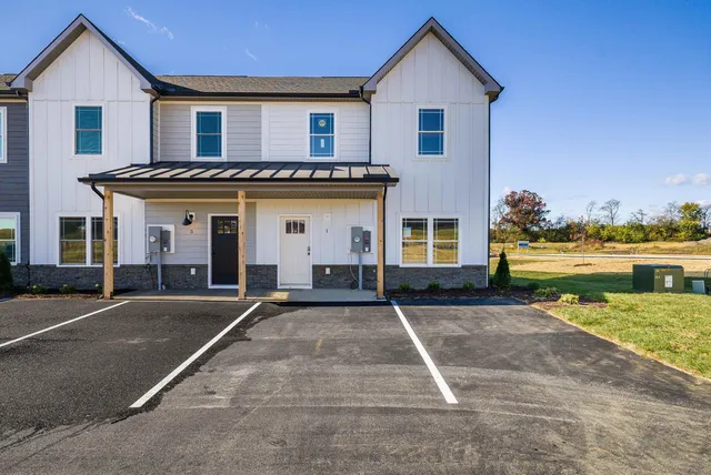 a kitchen with stainless steel appliances granite countertop a refrigerator stove and microwave