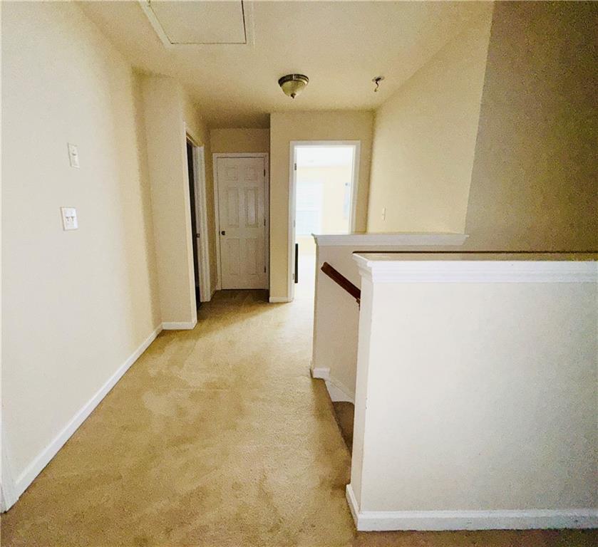 164 Thorncrest Court Tucker, GA 30084 - Photo 14 of 26 a view of a hallway with wooden floor