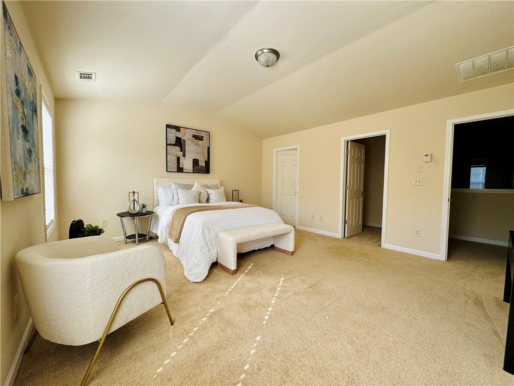 164 Thorncrest Court Tucker, GA 30084 - Photo 15 of 26 a bedroom with bed and a table