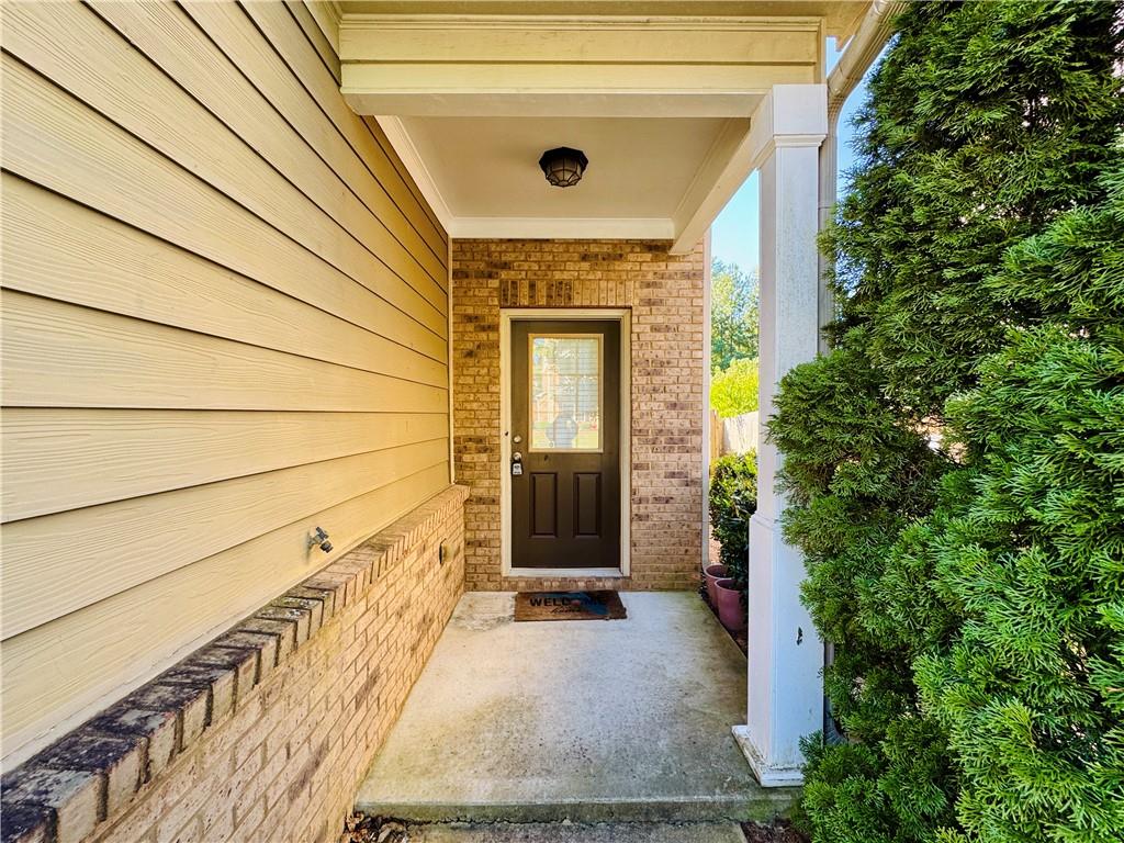 164 Thorncrest Court Tucker, GA 30084 - Photo 2 of 26 an entrance to house with yard