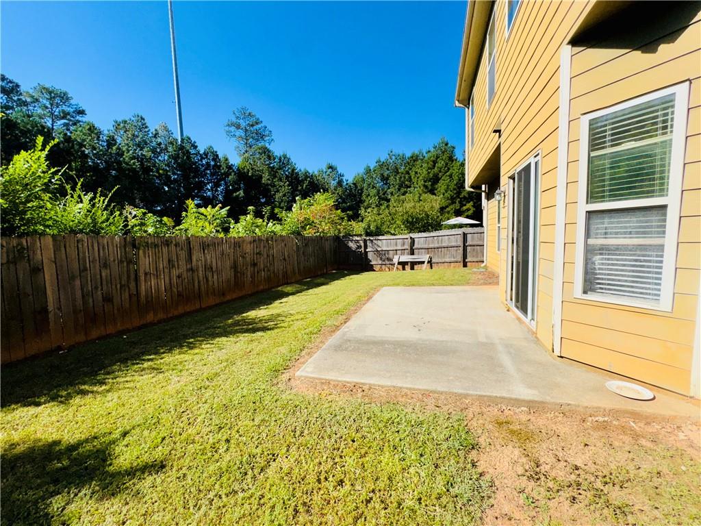 164 Thorncrest Court Tucker, GA 30084 - Photo 26 of 26 a view of a backyard with sitting area