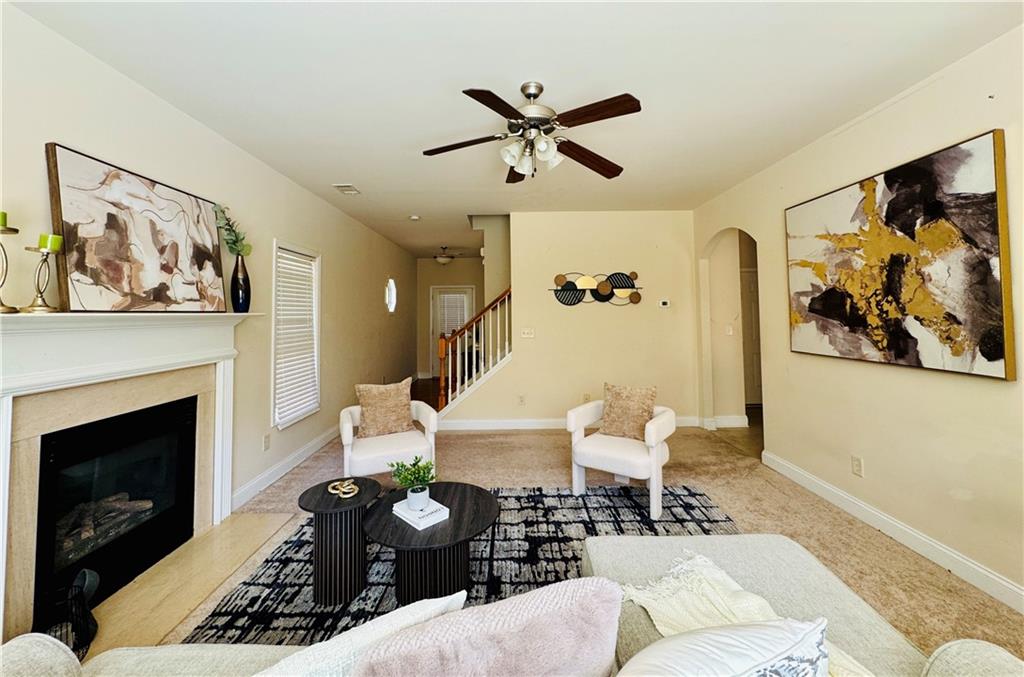 164 Thorncrest Court Tucker, GA 30084 - Photo 6 of 26 a living room with furniture and a fireplace