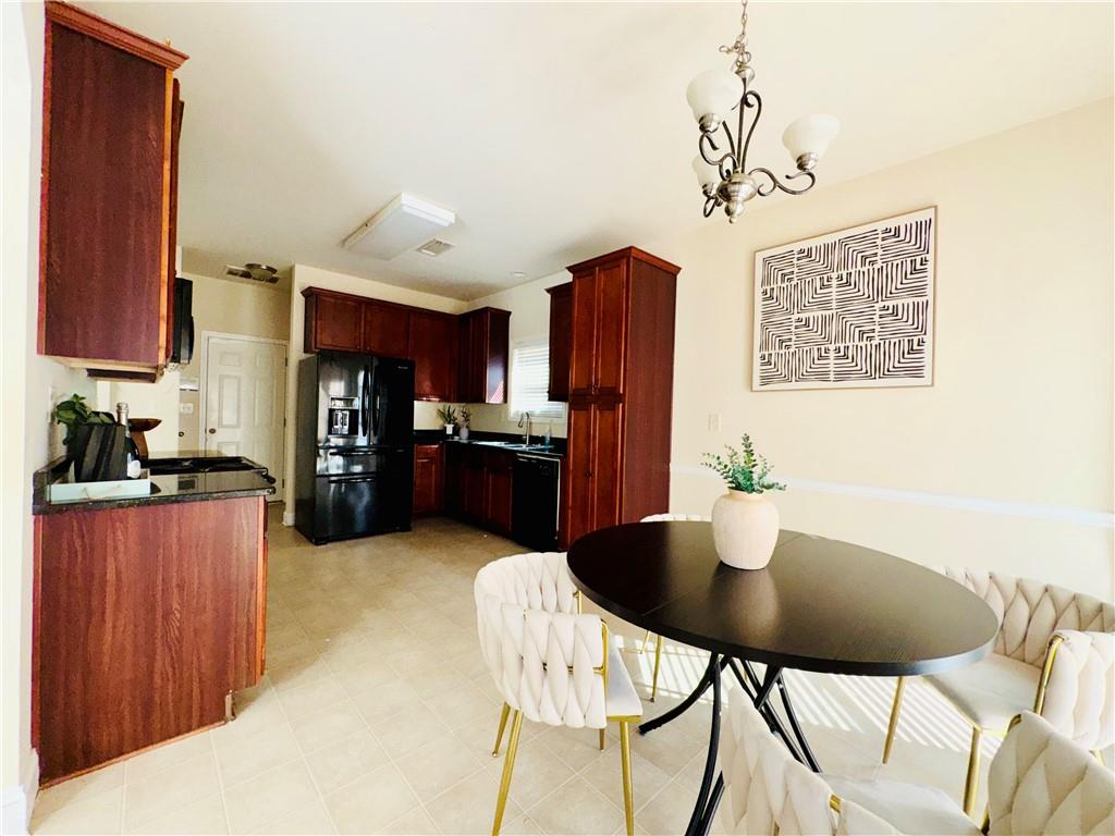 164 Thorncrest Court Tucker, GA 30084 - Photo 10 of 26 a kitchen with stainless steel appliances granite countertop a kitchen island a cabinets and a refrigerator