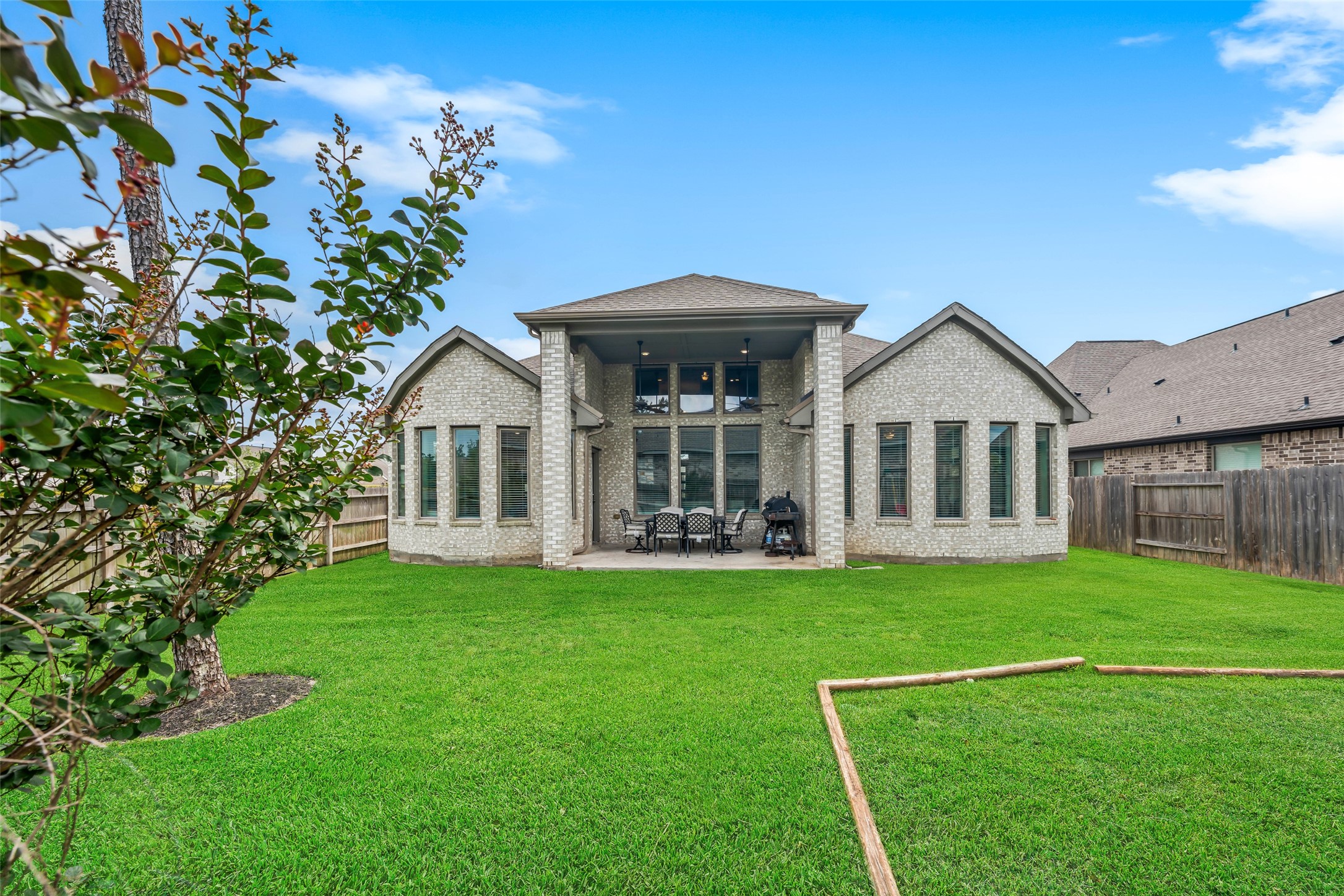 17323 Grand Canyon Road Conroe, TX 77302 - Photo 29 of 33 Outstanding back elevation wtih the tall central windows and double bay windows.