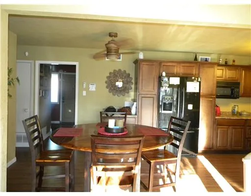 a dining room with a table and chairs