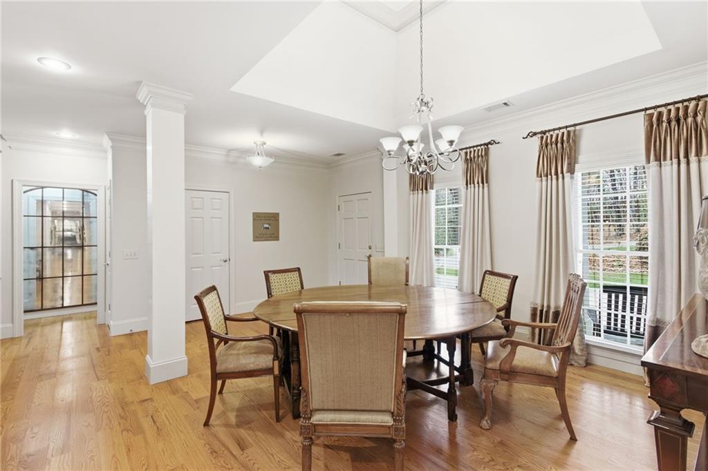 1038 Farmhouse Road Gainesville, GA 30506 - Photo 18 of 51 a view of a dining room with furniture window and wooden floor