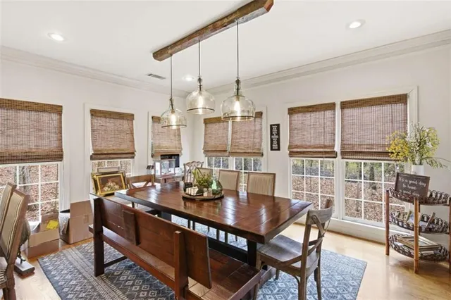 a view of a dining room with furniture window and wooden floor