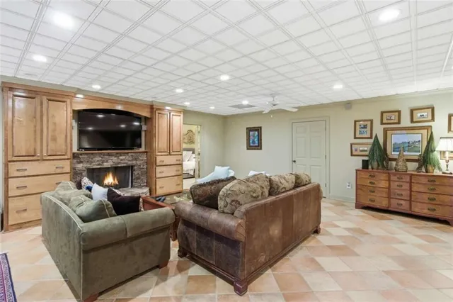 a kitchen with stainless steel appliances kitchen island granite countertop a sink and cabinets