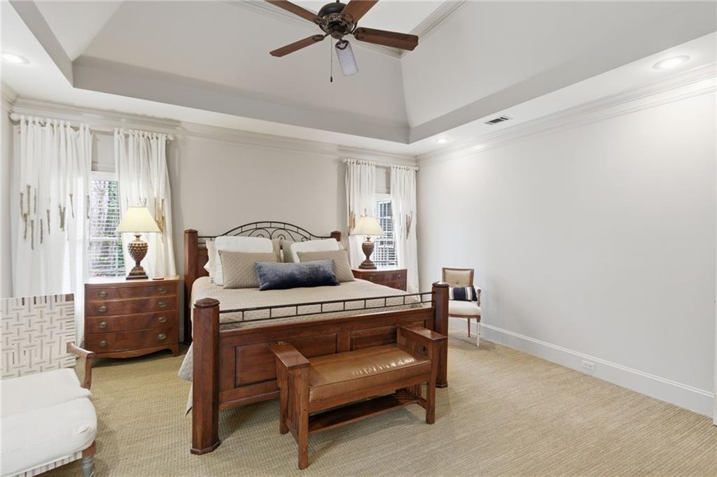 1038 Farmhouse Road Gainesville, GA 30506 - Photo 29 of 51 a bedroom with a bed and a chandelier