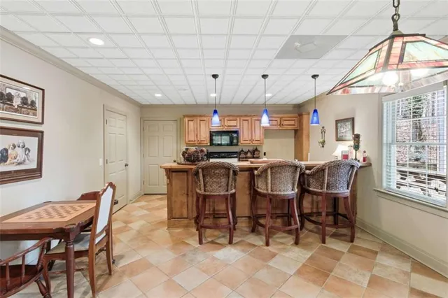 a view of a dining room and hall with furniture