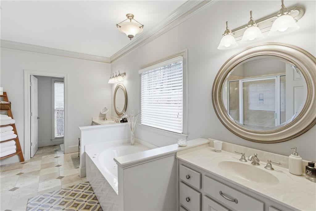 1038 Farmhouse Road Gainesville, GA 30506 - Photo 30 of 51 a bathroom with a sink and a mirror