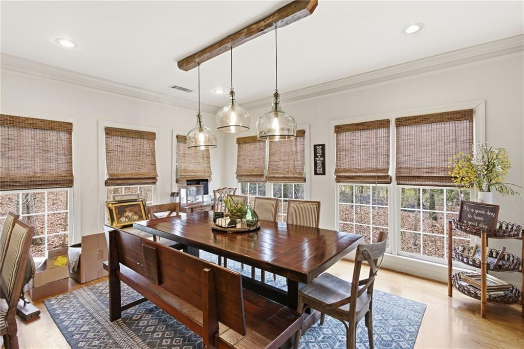 1038 Farmhouse Road Gainesville, GA 30506 - Photo 34 of 51 a view of a dining room with furniture window and wooden floor