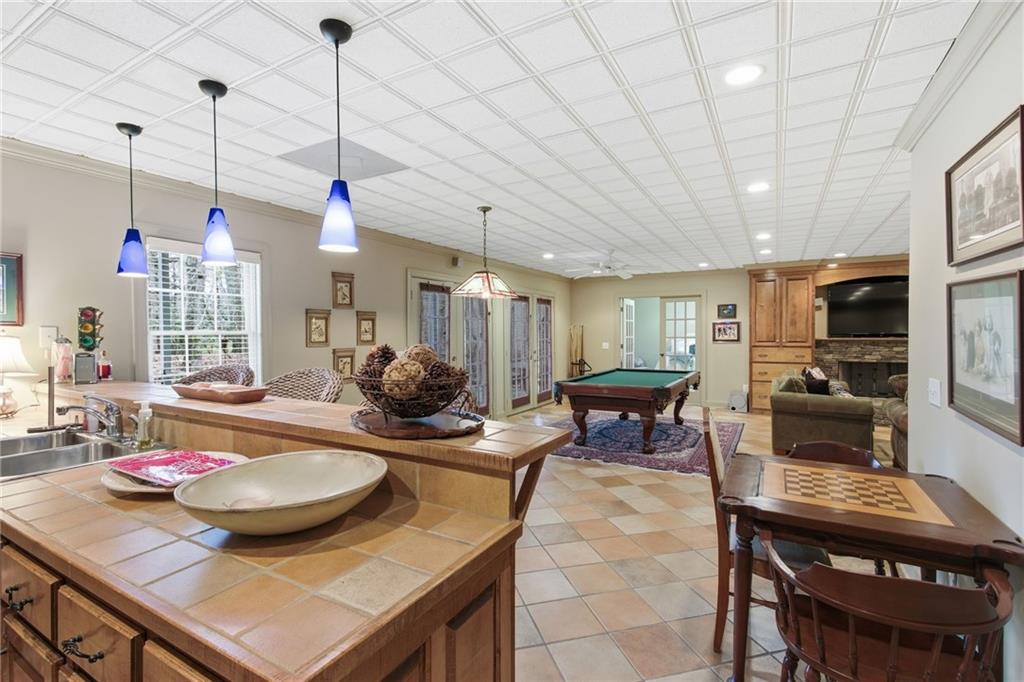 1038 Farmhouse Road Gainesville, GA 30506 - Photo 46 of 51 a view of a dining room and livingroom furniture wooden floor a rug and chandelier