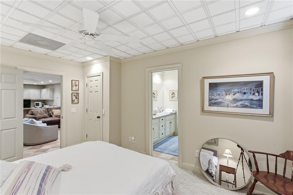 1038 Farmhouse Road Gainesville, GA 30506 - Photo 49 of 51 a bedroom with a bed and a view of bathroom