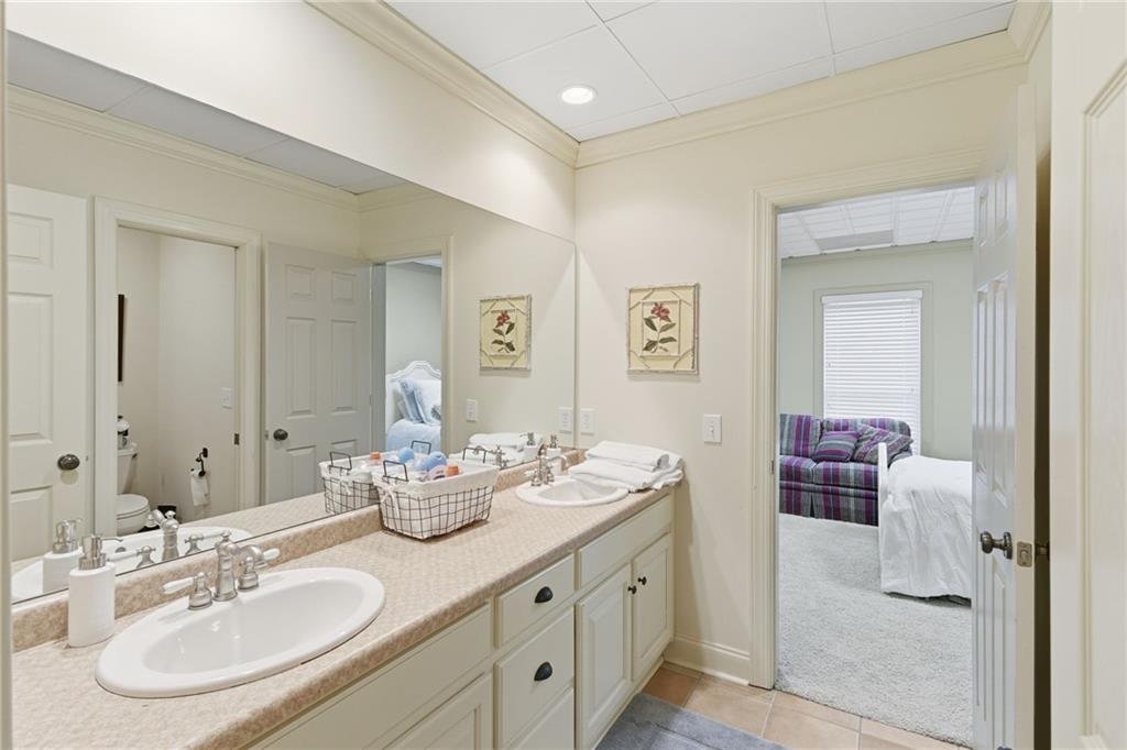 1038 Farmhouse Road Gainesville, GA 30506 - Photo 50 of 51 a bathroom with a double vanity sink and a mirror