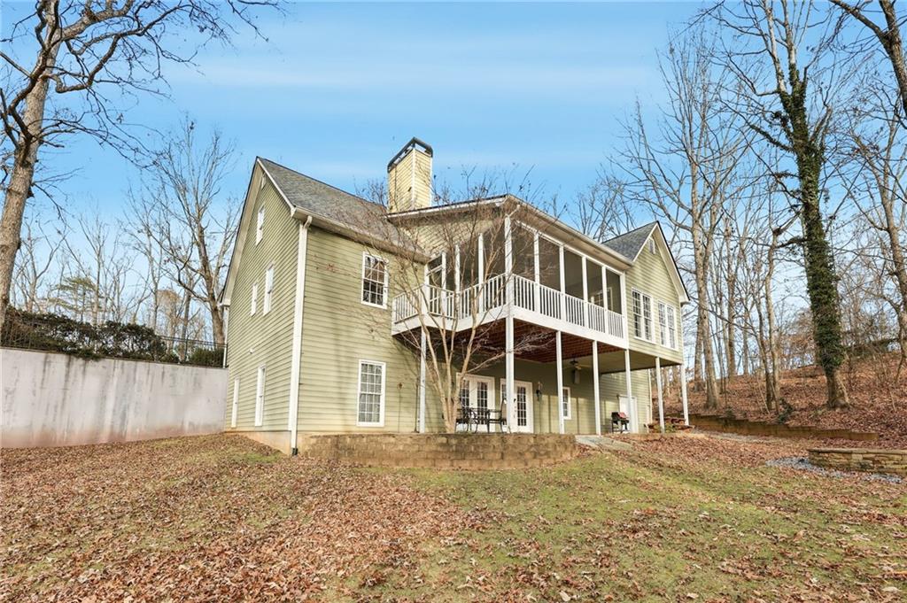 1038 Farmhouse Road Gainesville, GA 30506 - Photo 8 of 51 a front view of a house with a garden