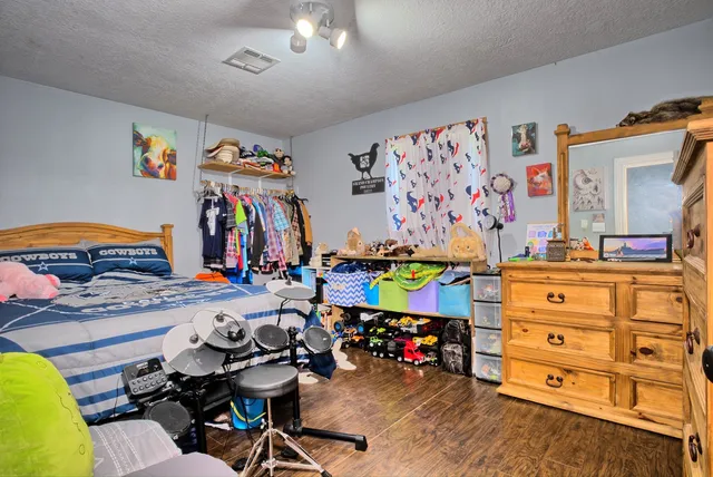 a bathroom with a sink a toilet a mirror and shower