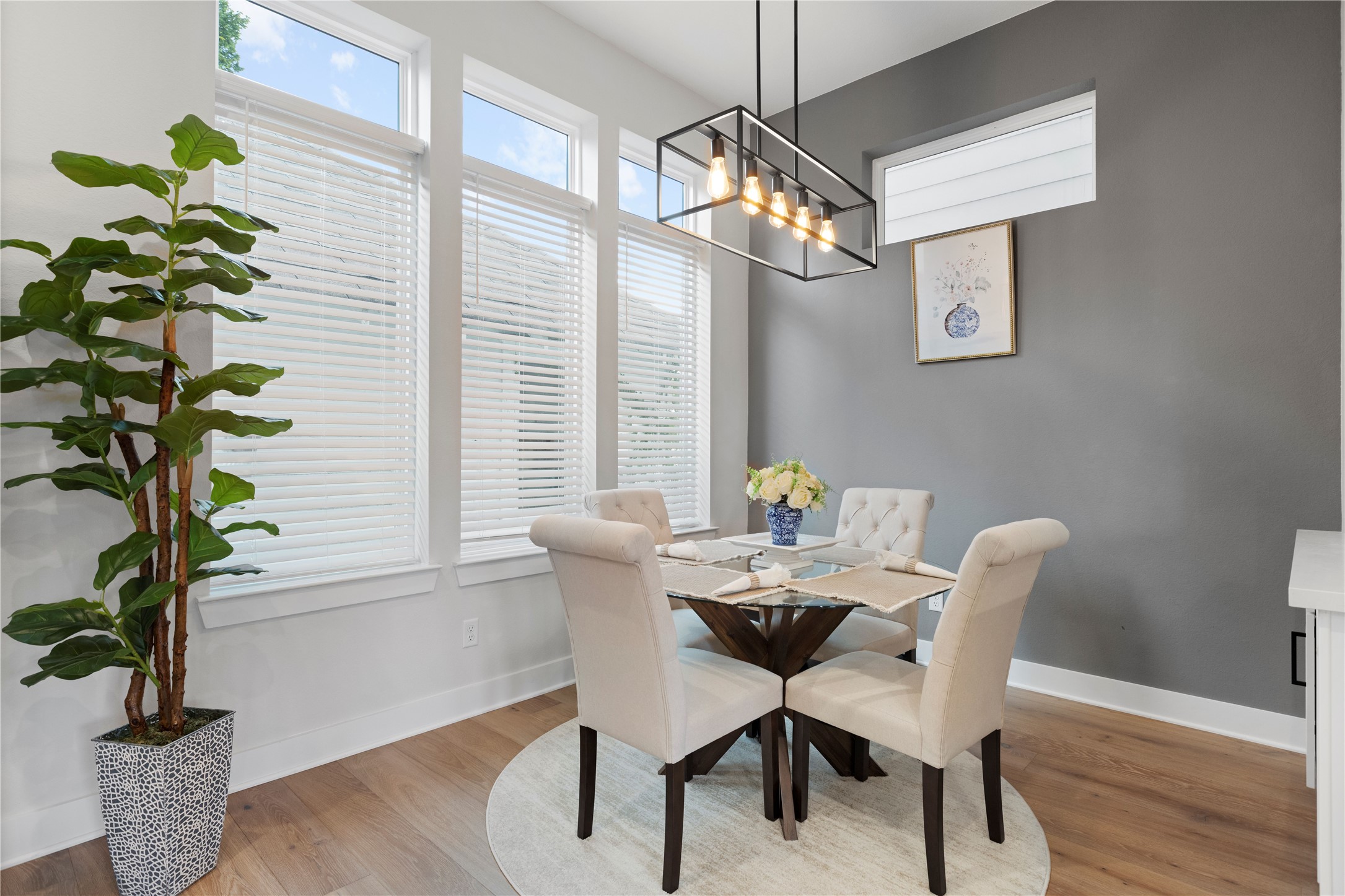 1410 Milby Street, Unit C Houston, TX 77003 - Photo 13 of 28 a view of a dining room with furniture wooden floor and chandelier