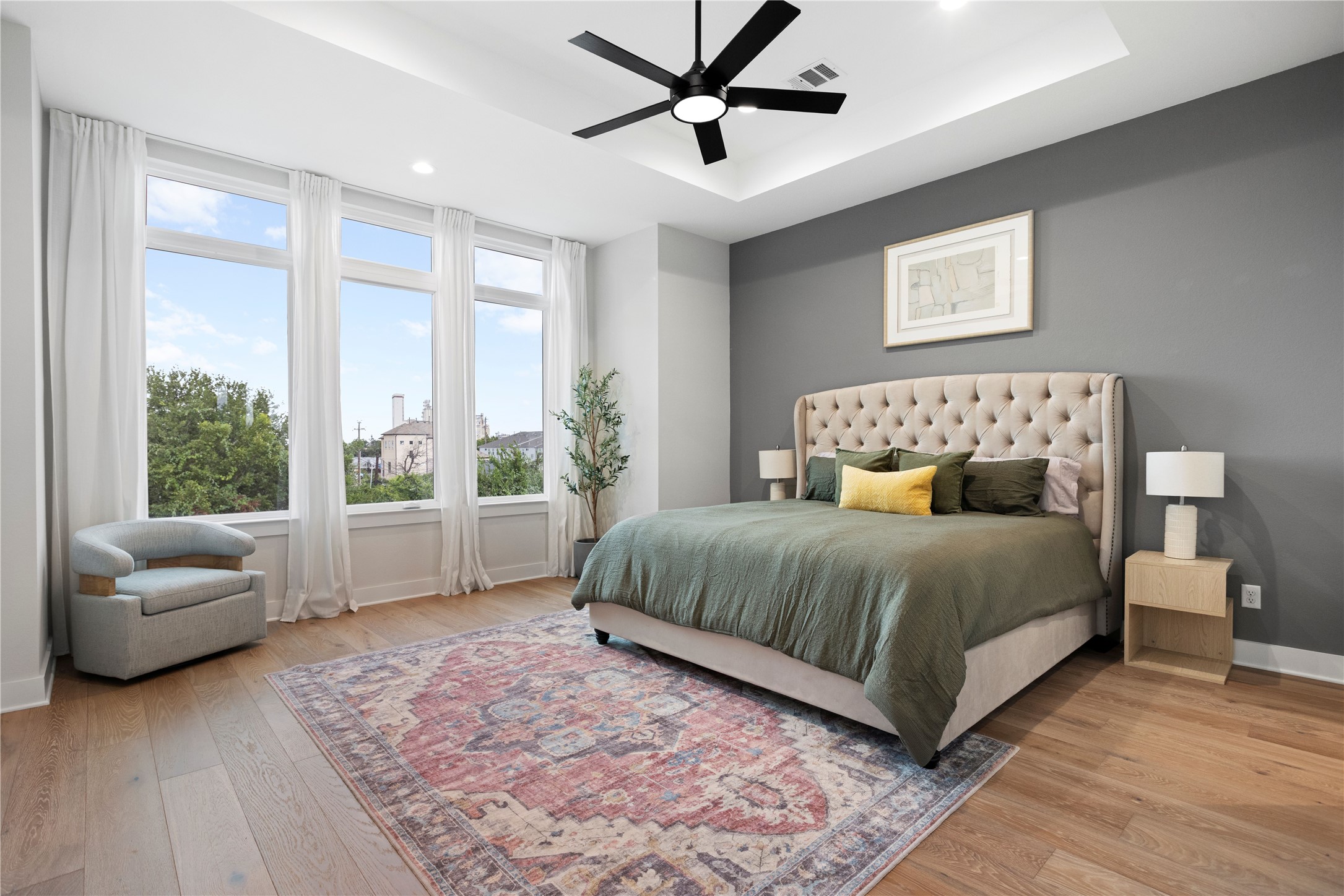 1410 Milby Street, Unit C Houston, TX 77003 - Photo 15 of 28 a bedroom with a large bed couch and a large window