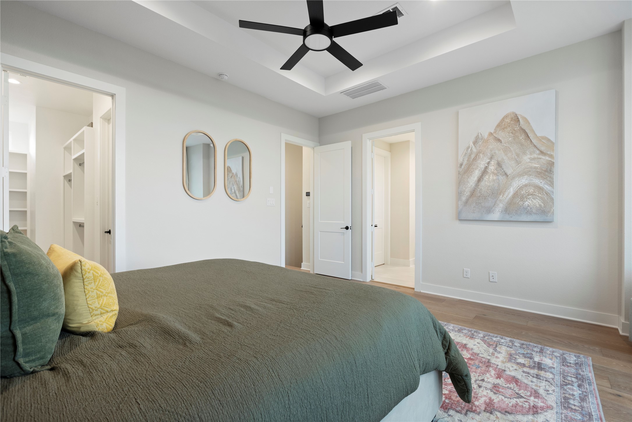 1410 Milby Street, Unit C Houston, TX 77003 - Photo 16 of 28 a bedroom with a bed and painting on the wall