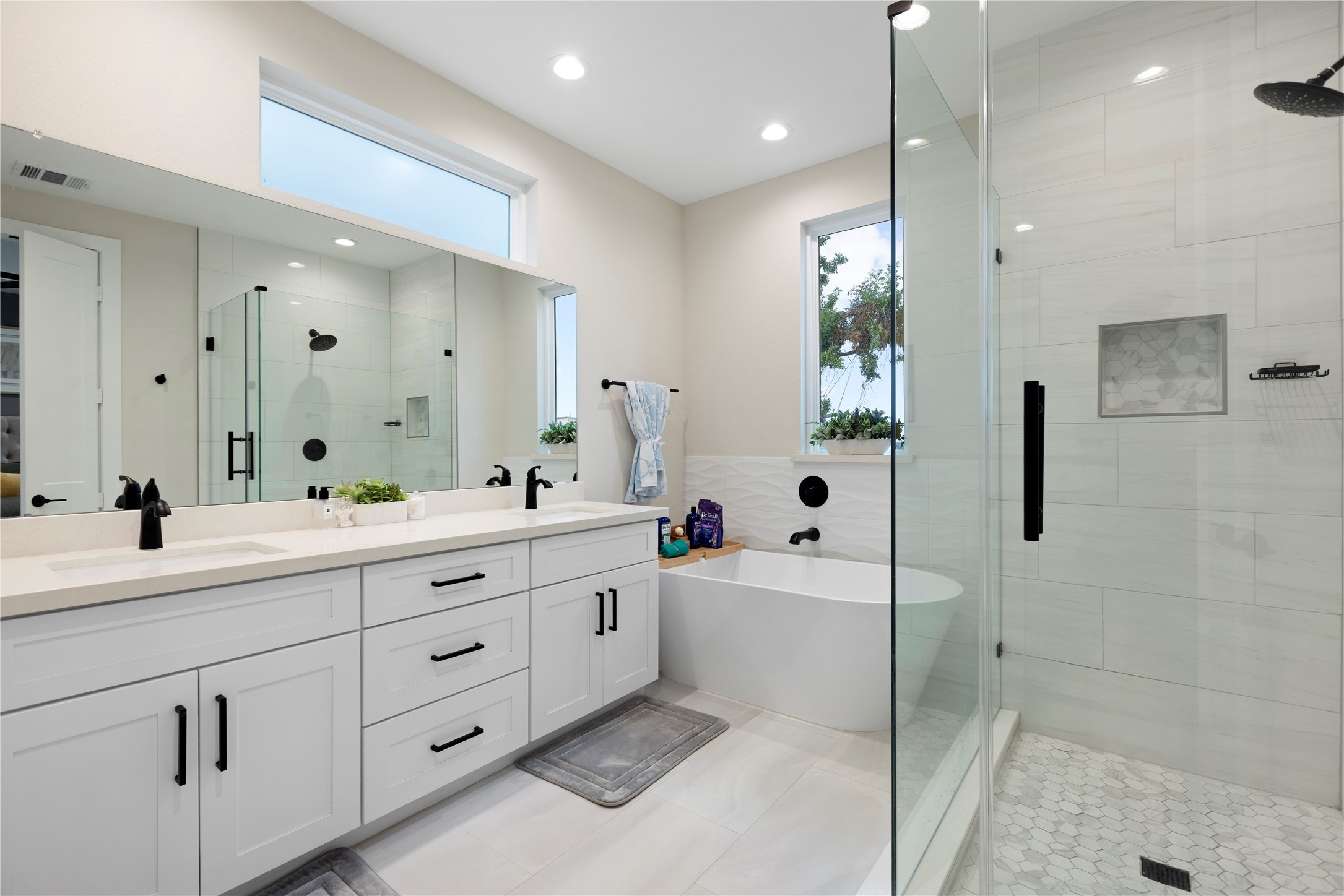 1410 Milby Street, Unit C Houston, TX 77003 - Photo 18 of 28 a spacious bathroom with double sink a large mirror and shower