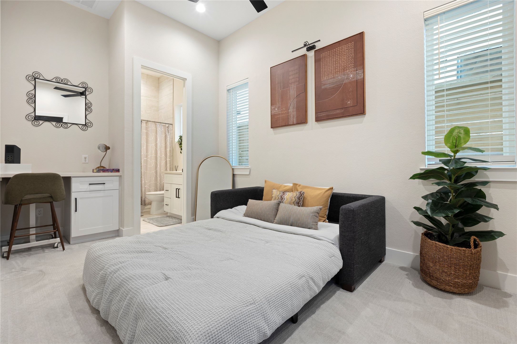 1410 Milby Street, Unit C Houston, TX 77003 - Photo 21 of 28 a bedroom with a bed and a potted plant